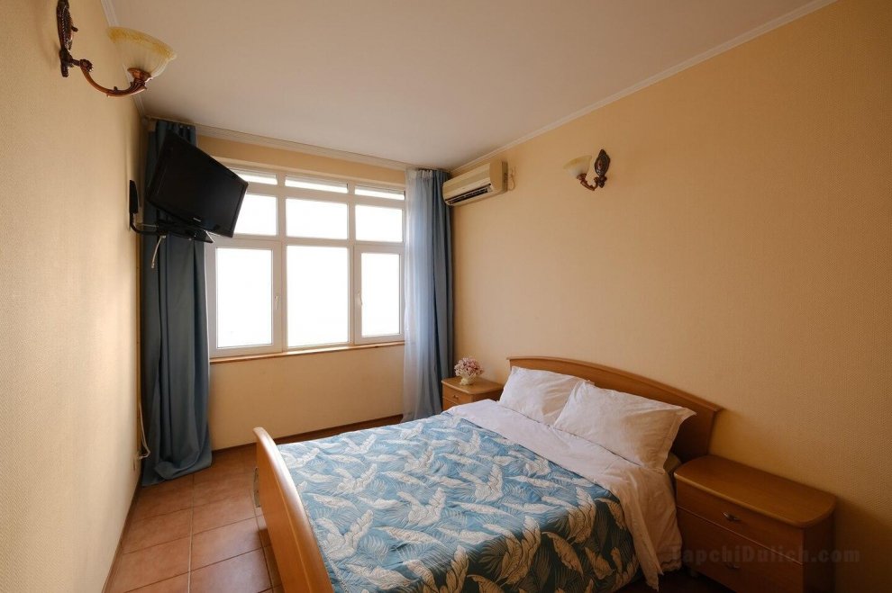 Room with double bed and sea view