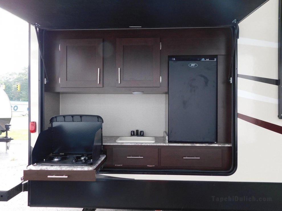 Air conditioned RV trailer in quiet caravan site